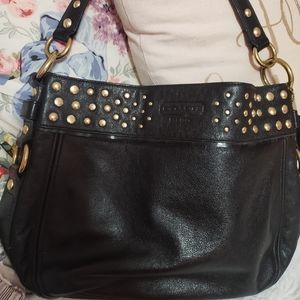 Coach black with studs and purple lining
